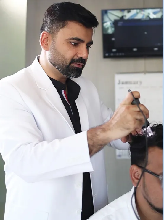 Dermatologist examining a patient's scalp at HairSense Hair Transplant Clinic, Vashi