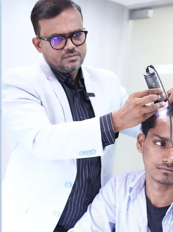 Dermatologist hair transplant surgeon examining a patient at HairSense, Navi Mumbai
